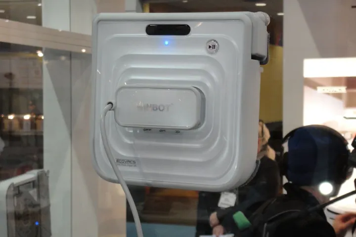 The Winbot 7 window cleaning robot adheres to a window using a pair of concentric suction rings