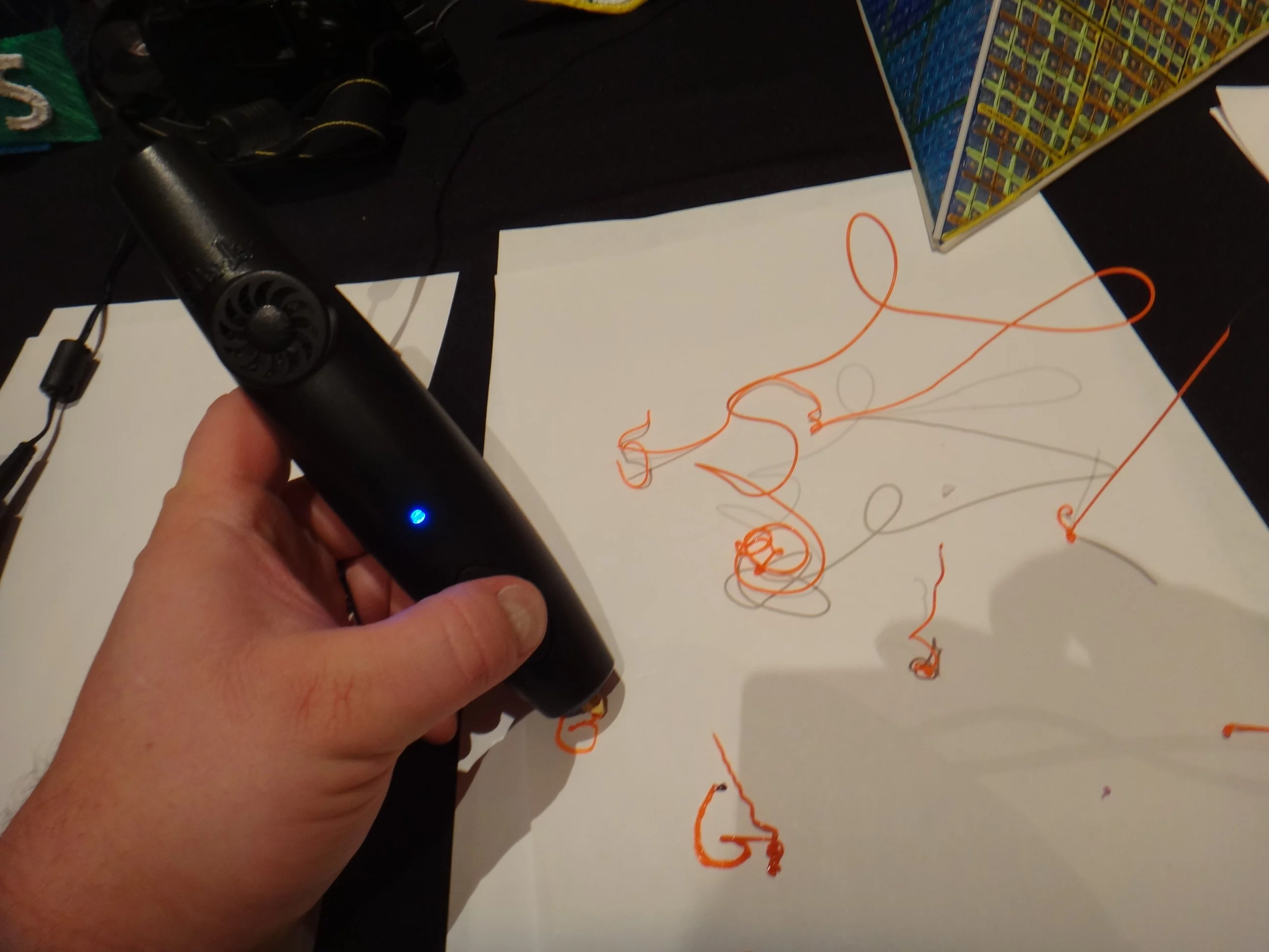 During CES 2014, Gizmag had the chance to try out the 3Doodler, a "3D drawing pen" that uses plastic filament instead of ink to sketch inventive objects