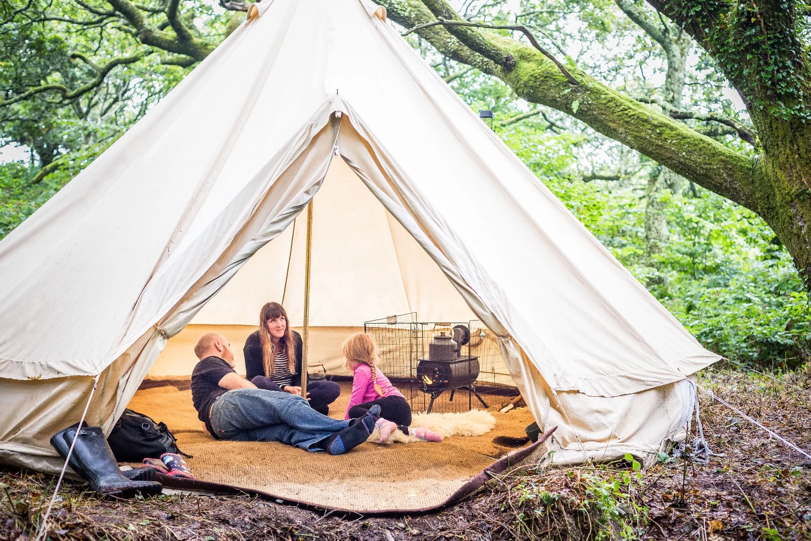 The flue can exit through a side wall, roof, or the vent of a tent