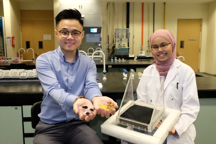 Asst. Prof. Edison Ang (left) with samples of the fruit waste and the molybdenum carbide – one of his colleagues holds a solar still equipped with a black sheet of latter material