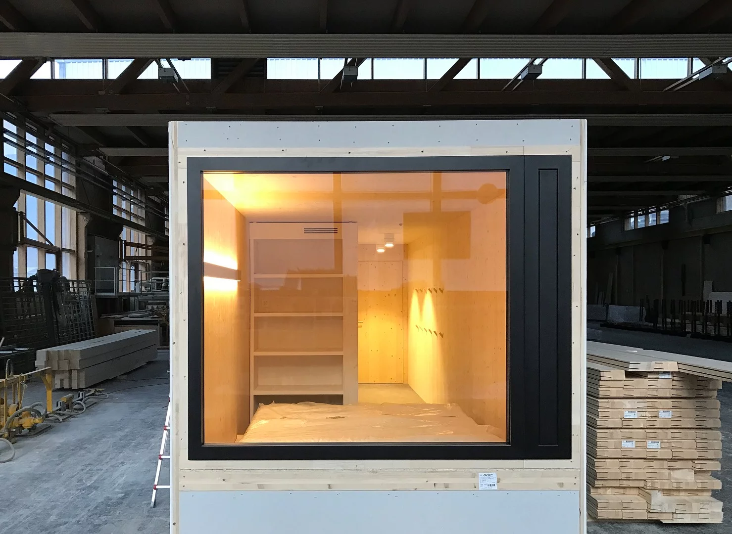 Each of the 96 rooms making up the four floors of the Revier Mountain Lodge was crafted from natural unfinished plywood and fabricated off site