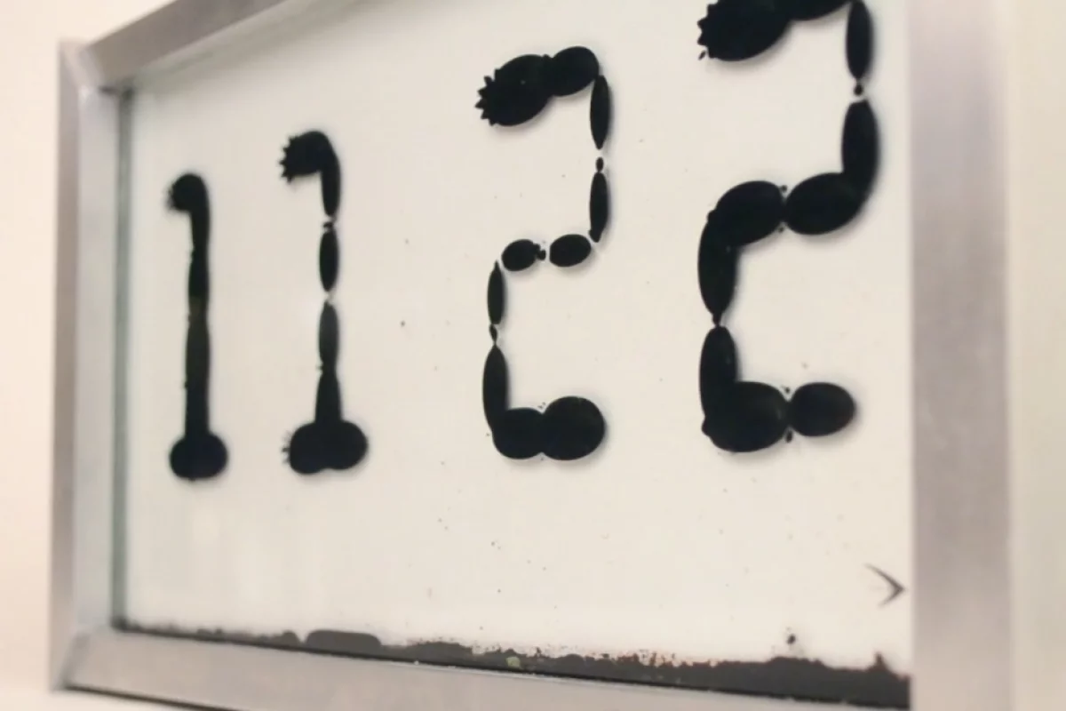 Ferrolic is a clock which tells the time by manipulating ferrofluid using electromagnets