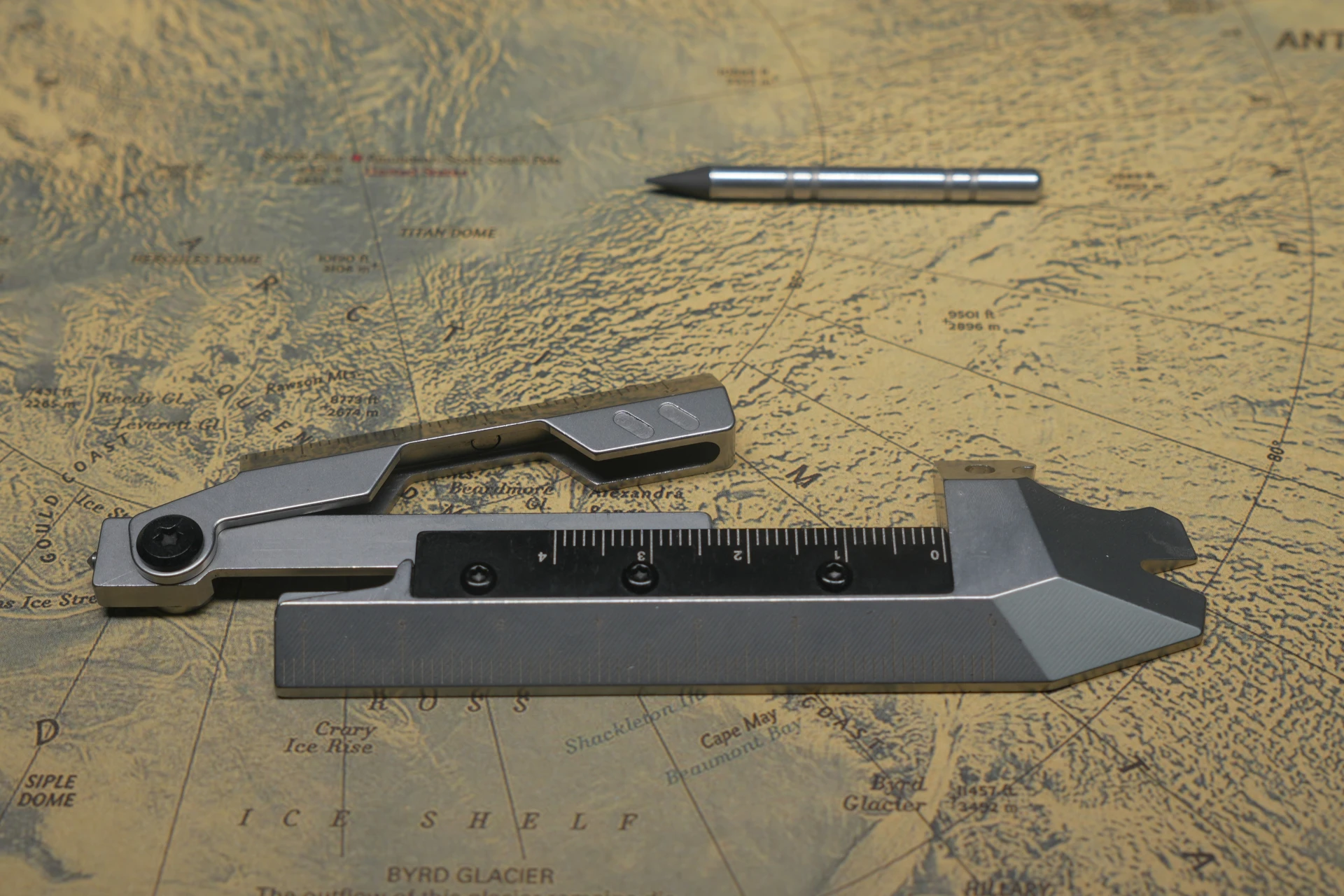 Steel folding-ruler multitool packs a pencil, caliper, pry bar and more