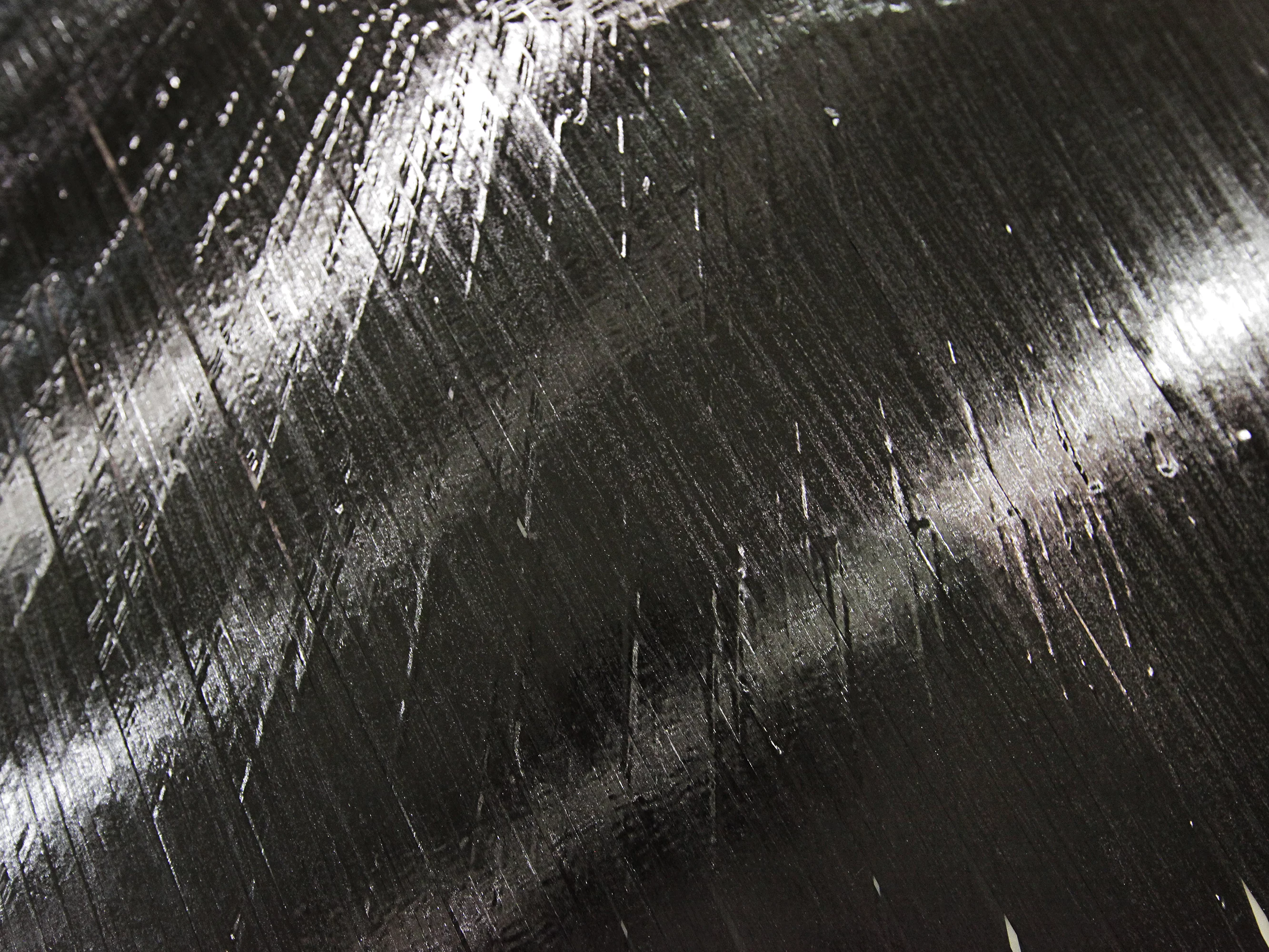 This closeup shows a sheet of carbon-fiber-and-epoxy ribbons created by ISAAC (Photo: NASA/David C. Bowman)