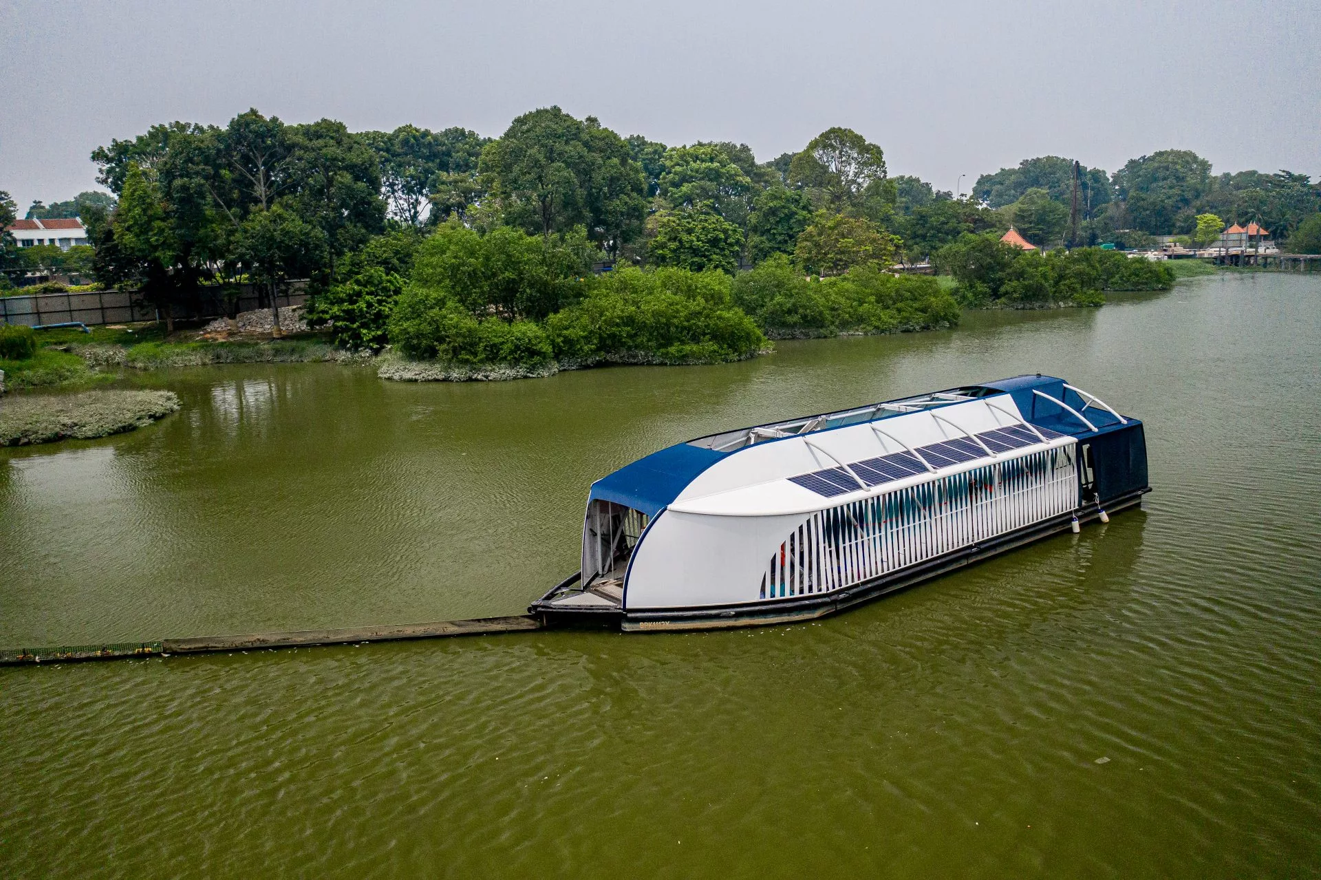 The Interceptor is essentially a catamaran that uses a long floating barrier to guide trash into its opening