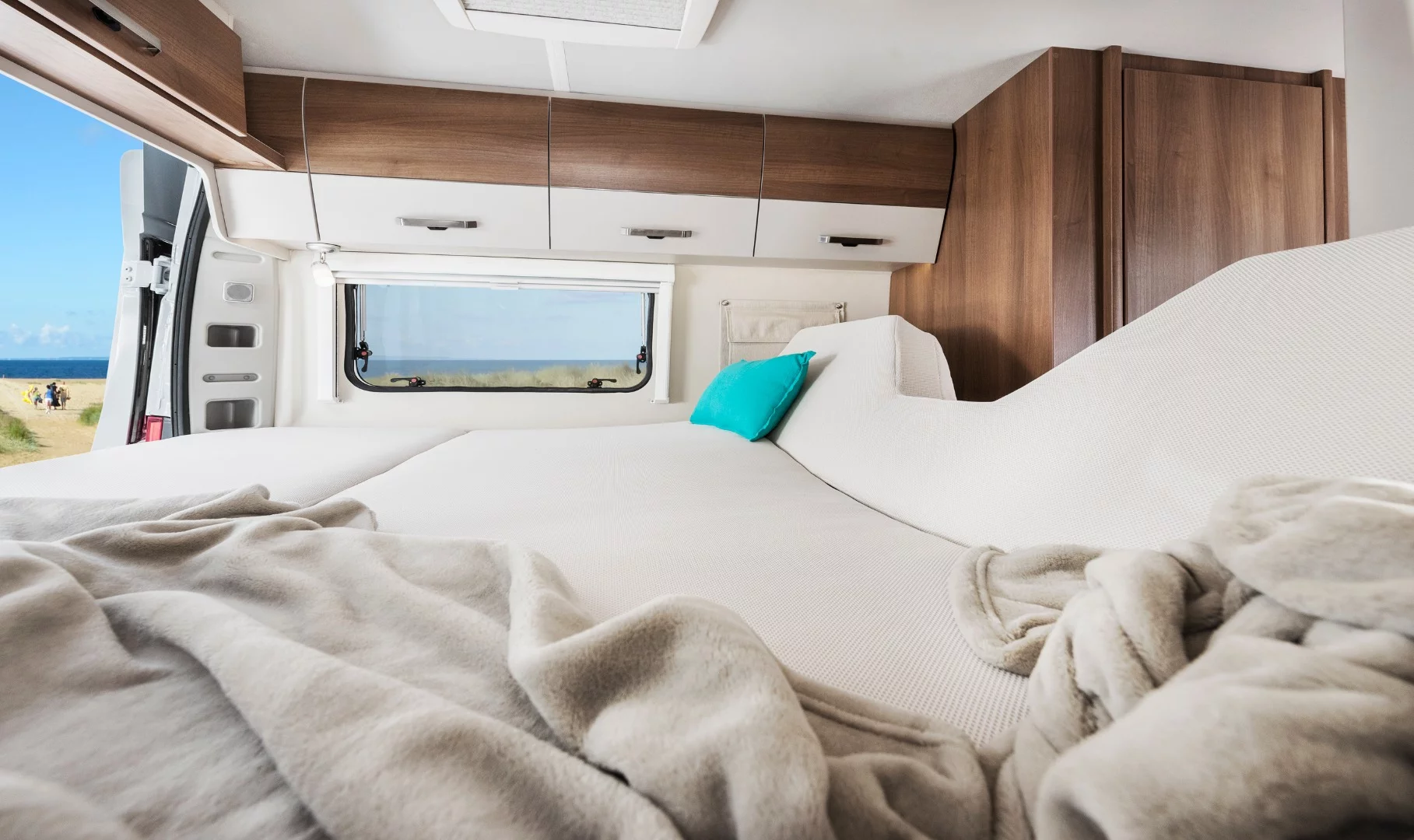 Lift the foot of the 600 and 630 L rear bed and you have a sofa lounge that looks out the rear doors, taking in the local views