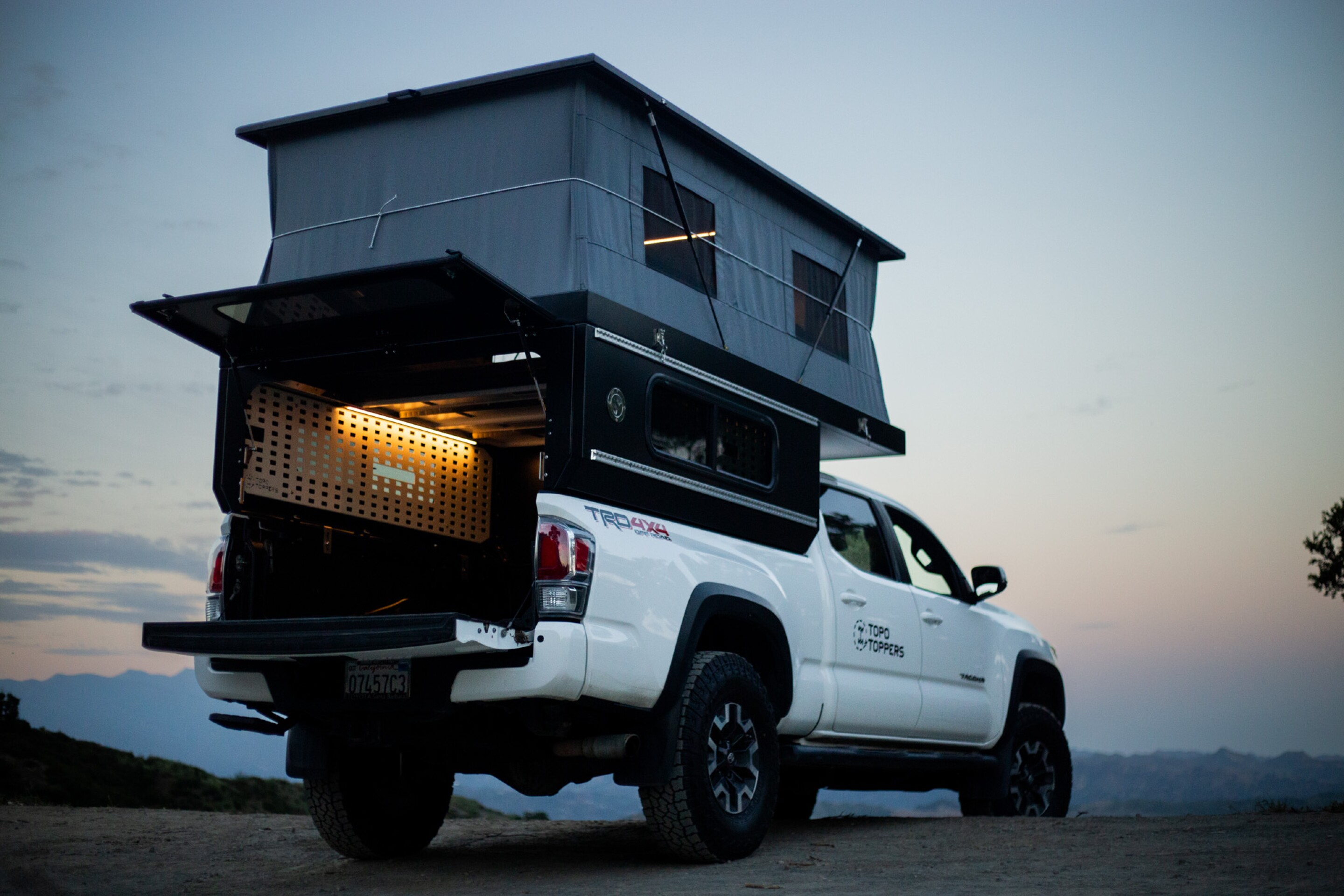 Sub-$10K Toyota pickup camper blows out cabin space with serious flare