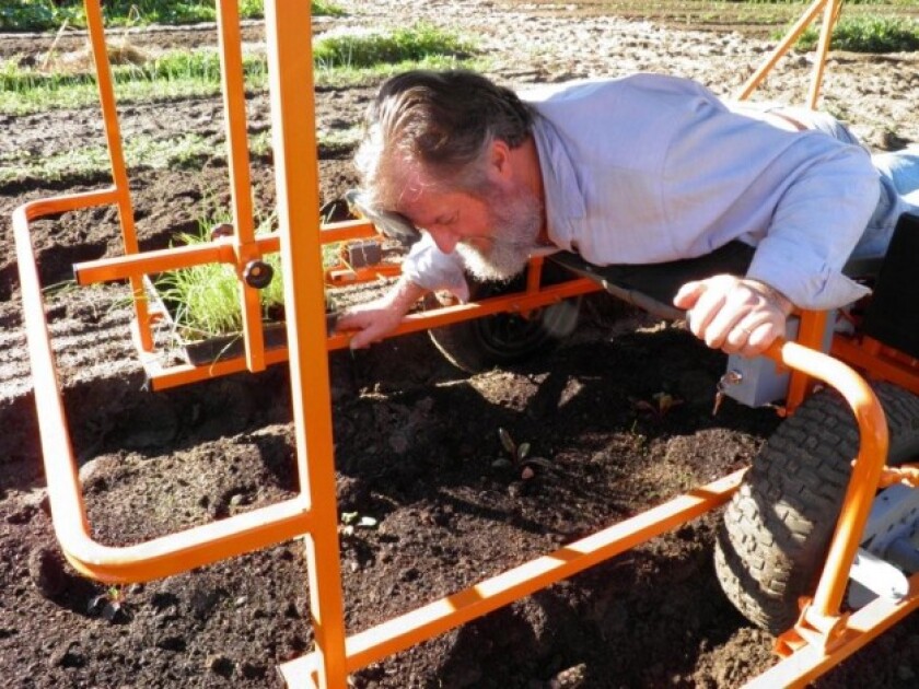 Inventor Brendan Corry demonstrating his Wunda Weeder