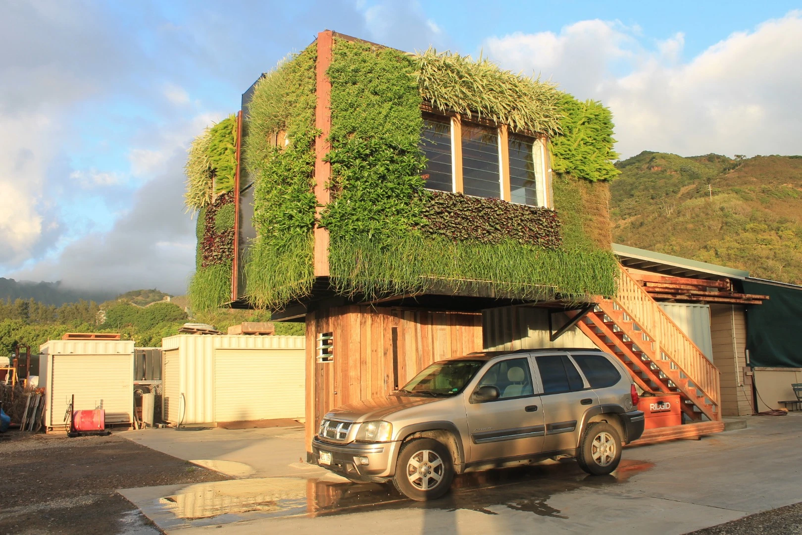 Elevate is raised between 8 - 12 ft (2.4 - 3.6 m) off the ground on a pedestal, that's enough room to park a car underneath