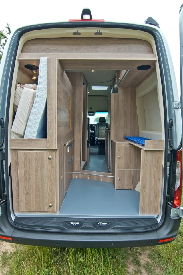 As with many camper vans, the rear bed of the Regent S folds out of the way to allow for through-loading of large cargo like bicycles