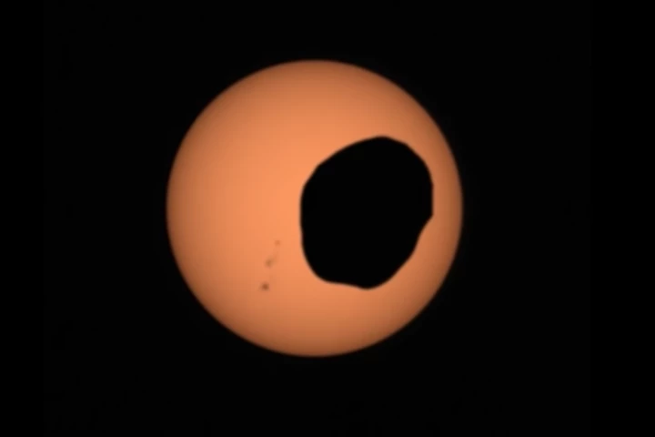 Still taken from a Perseverance video of a solar eclipse on Mars