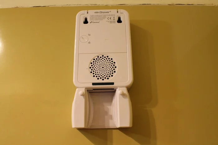 The speaker sitting atop its included shower mount