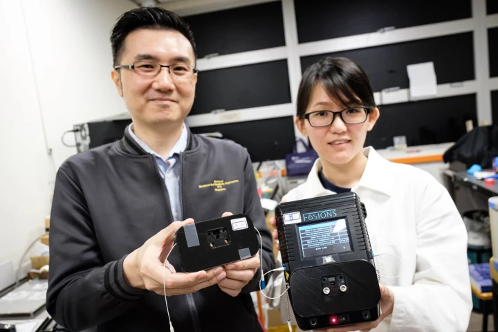 Assoc. Prof. Yong Ken-Tye (left) and PhD student Stephanie Yap, with the water-testing device