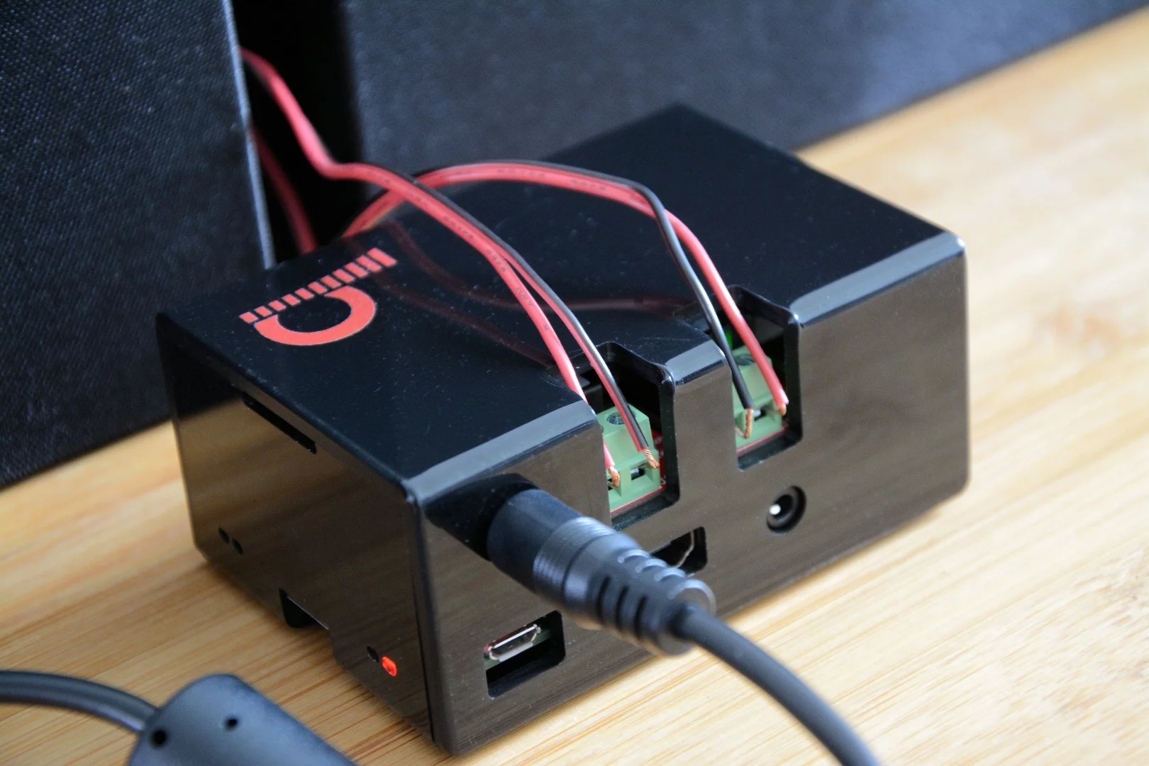 The JustBoom Amp HAT and Raspberry Pi it sits on are both powered by a single adapter