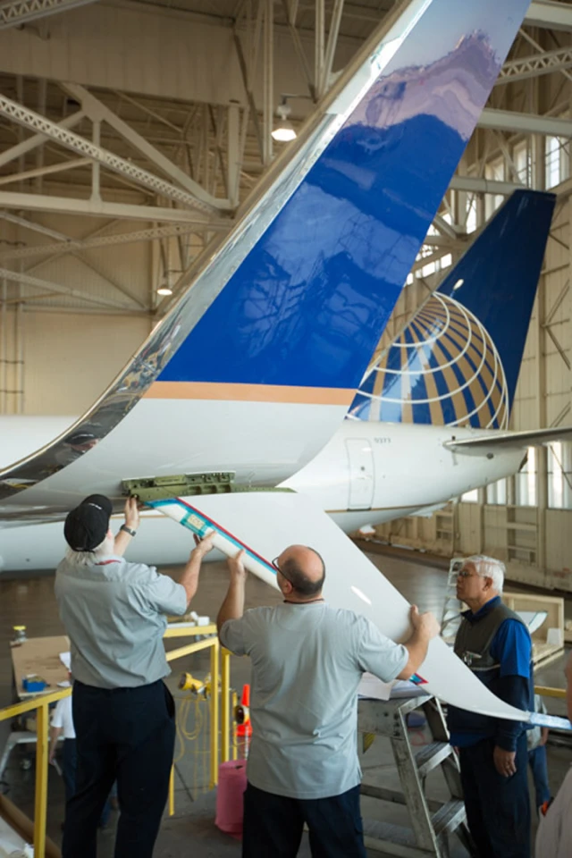Retrofittting Blended Winglets to Split Scimitars involves adding strengthening spars, aerodynamic "scimitar tips," and a large ventral strake
