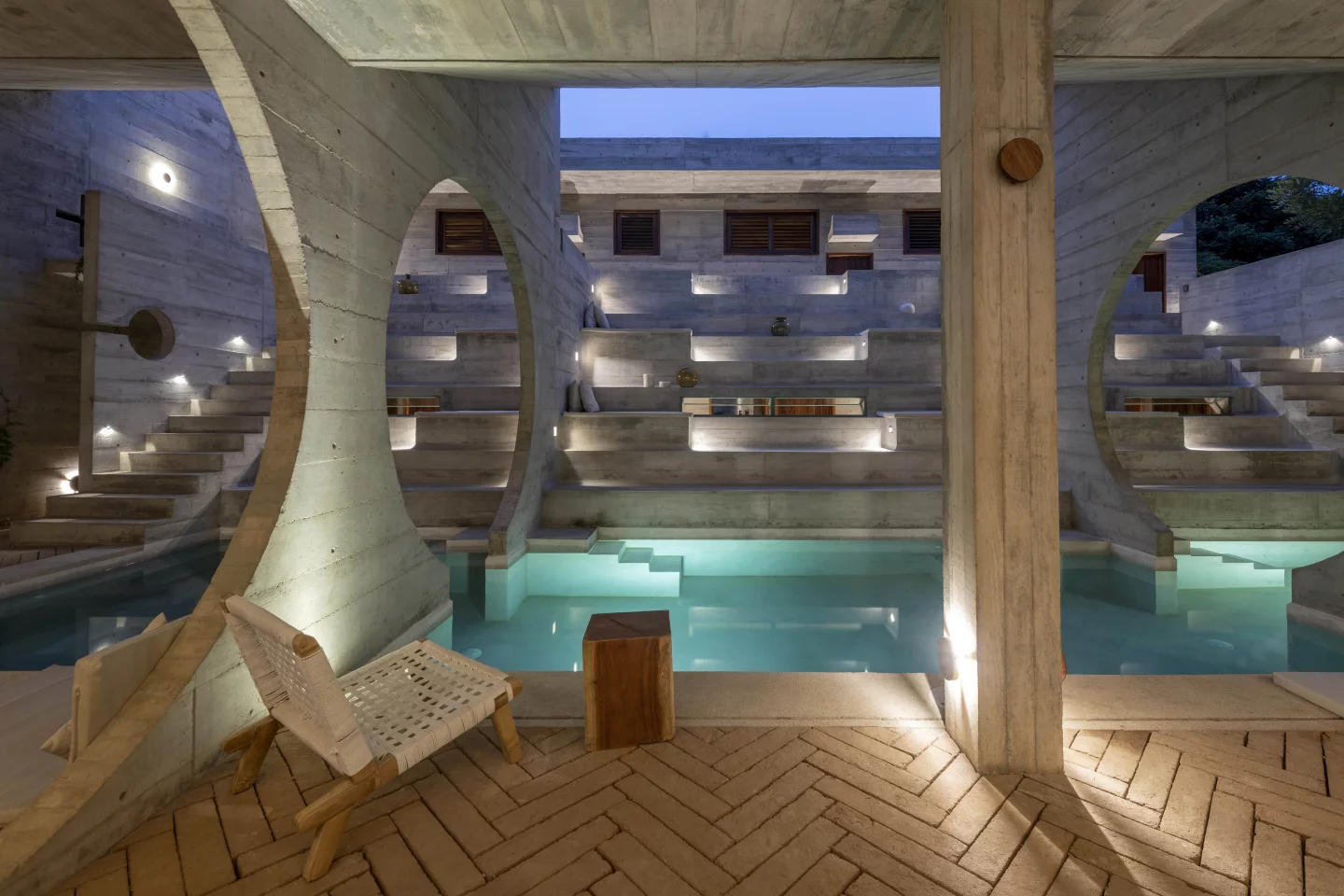 Casa TO is centered around a stunning infinity pool and solarium zone, which is encased by vaulted concrete volumes