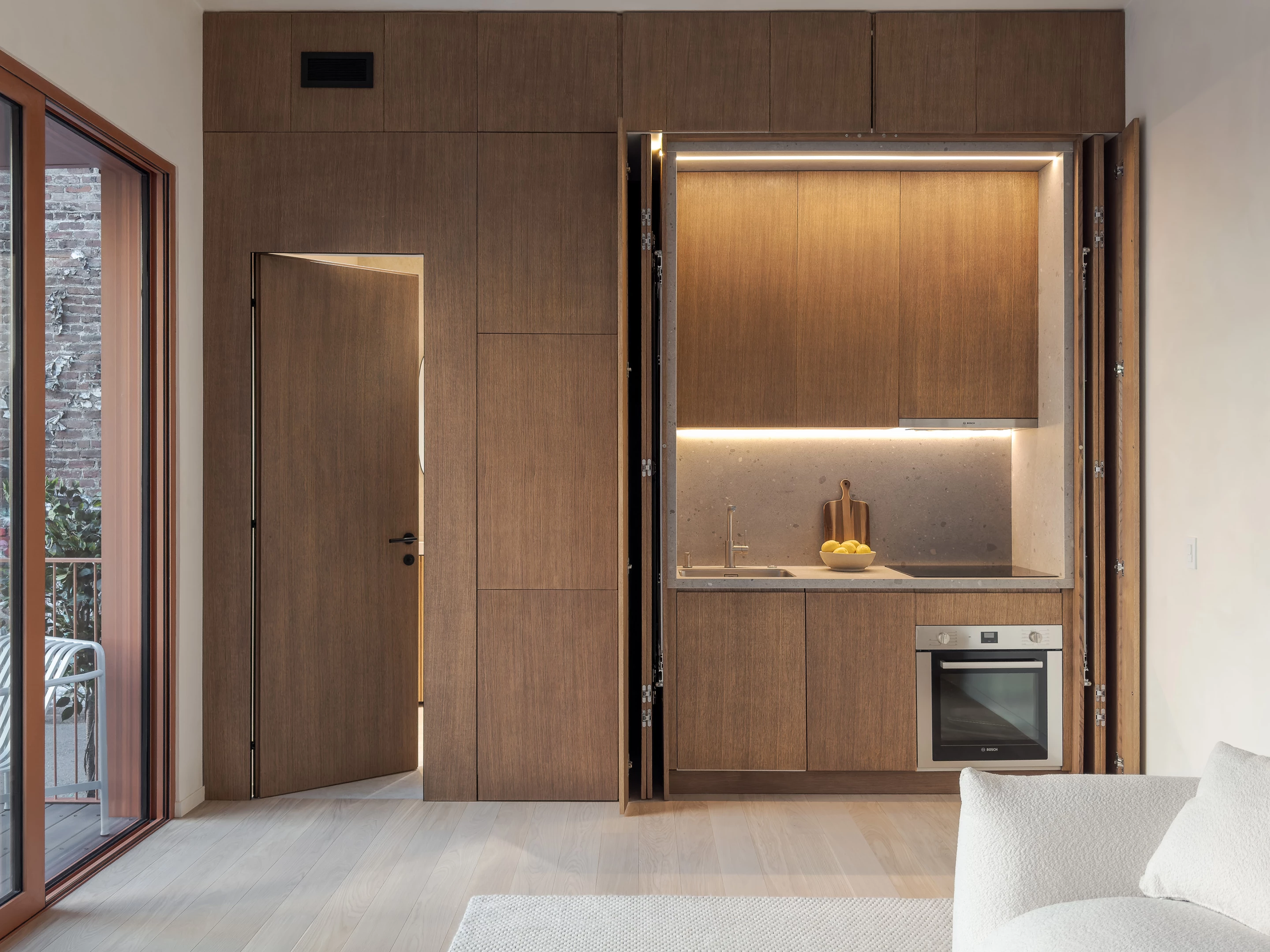The Cosmic One's kitchen is well-stocked and includes a dishwasher, fridge, oven, induction stove, and sink