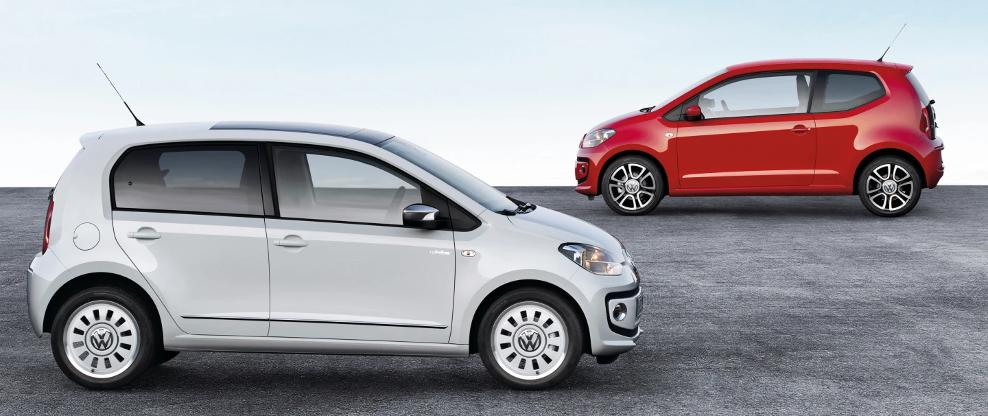 The new five-door up! (front) and the two-door model