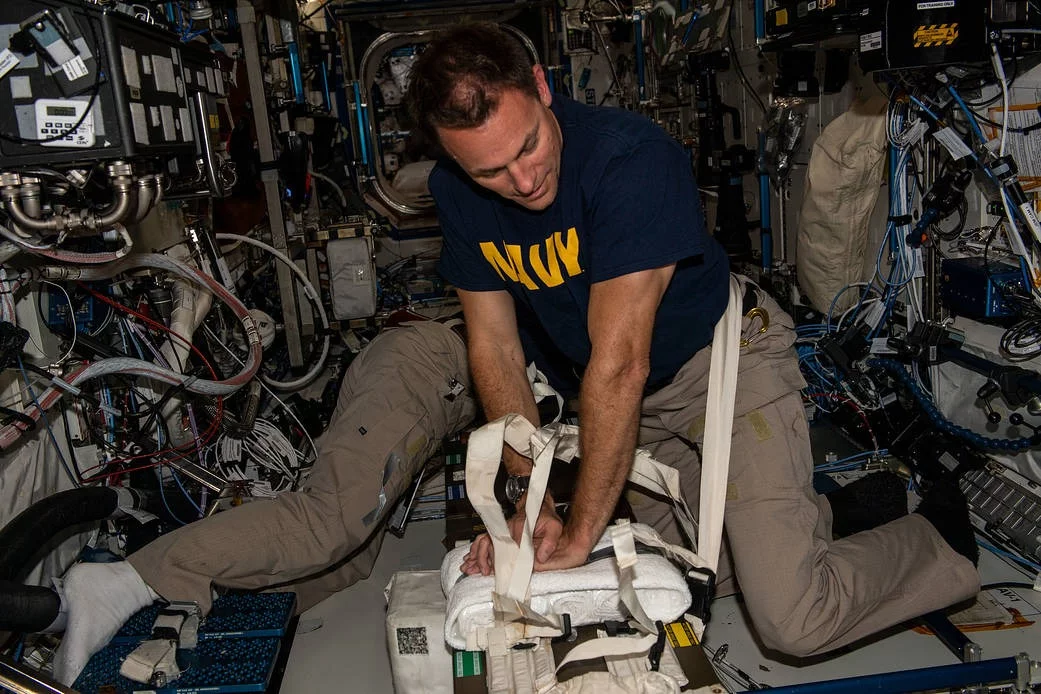 NASA astronaut Josh Cassada practices manual CPR aboard the International Space Station