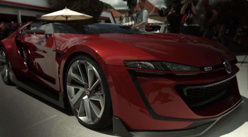 The Roadster loses the bladed inlets from last year's Design Vision concept and has narrower headlights