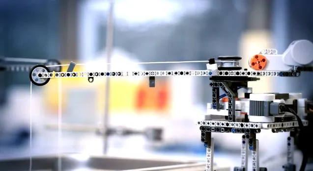The motor at the very top right-hand end of this robot is not powered, serving only as a counterweight