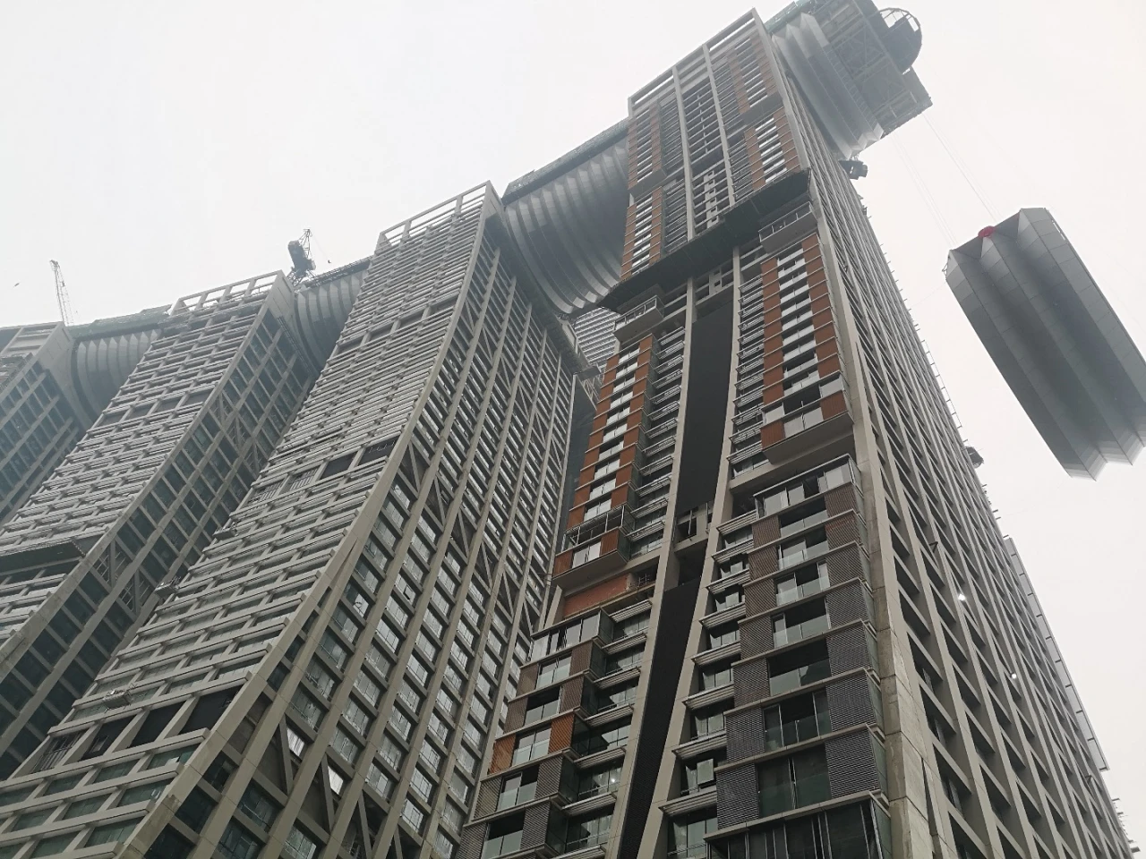 The Raffles City Chongqing's skybridge being hoisted into position