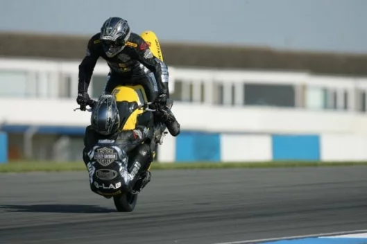 Craig Jones (riding) and Wing Chui (front wheel) breaking the world record at Donington.