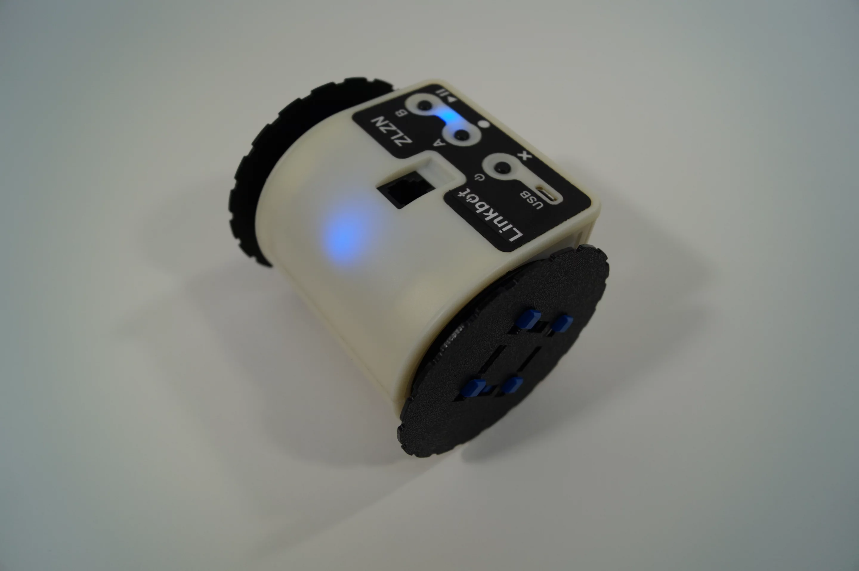A single Linkbot is ready to roll, turn, crawl, stand, and tumble out of the box