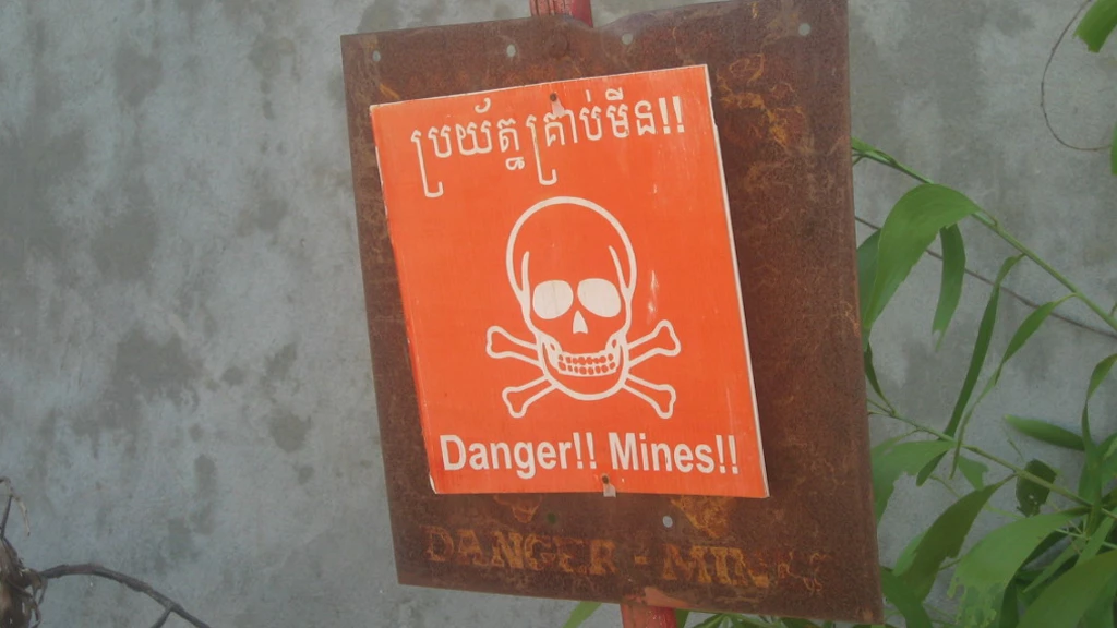 A land mine warning - a sight all to common in many parts of the world (Image: Kyle Simourd via Flickr)