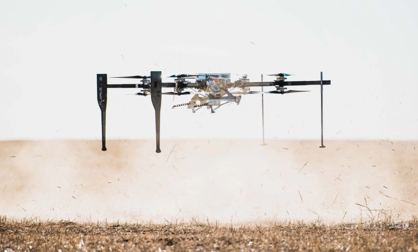 Although shown here landing on the ground (without a fixed-wing drone payload), the FLARES drone's low center of gravity allows it to land on the rolling decks of ships without falling over