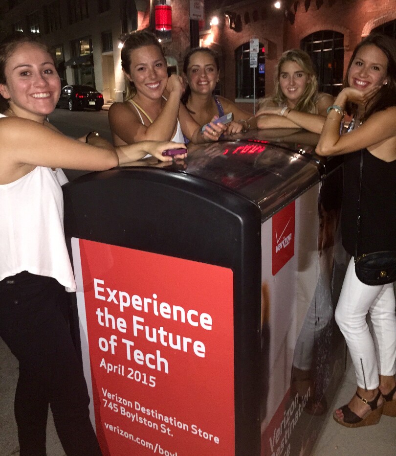 None of these ladies in Boston realized they were leaning up against the source of their free Wi-Fi connection
