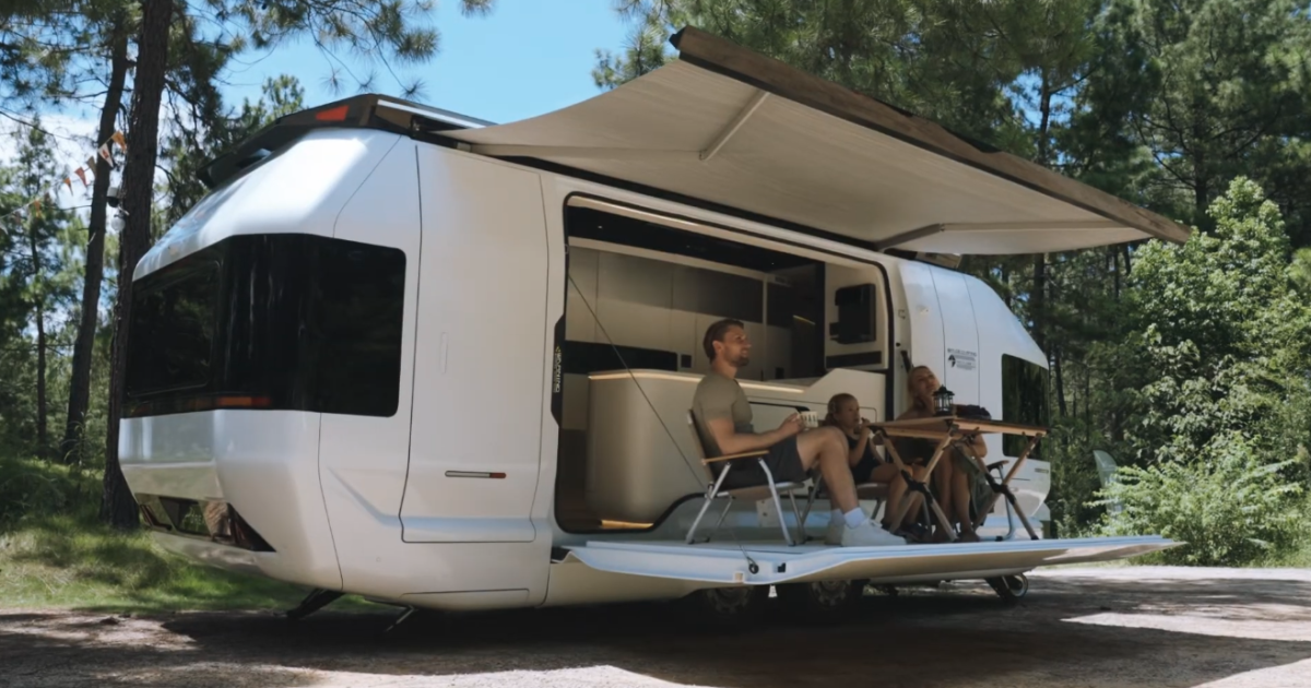 The Skydream camping trailer drops the better part of the sidewall into a level above-ground deck for dining, relaxing and taking in the views