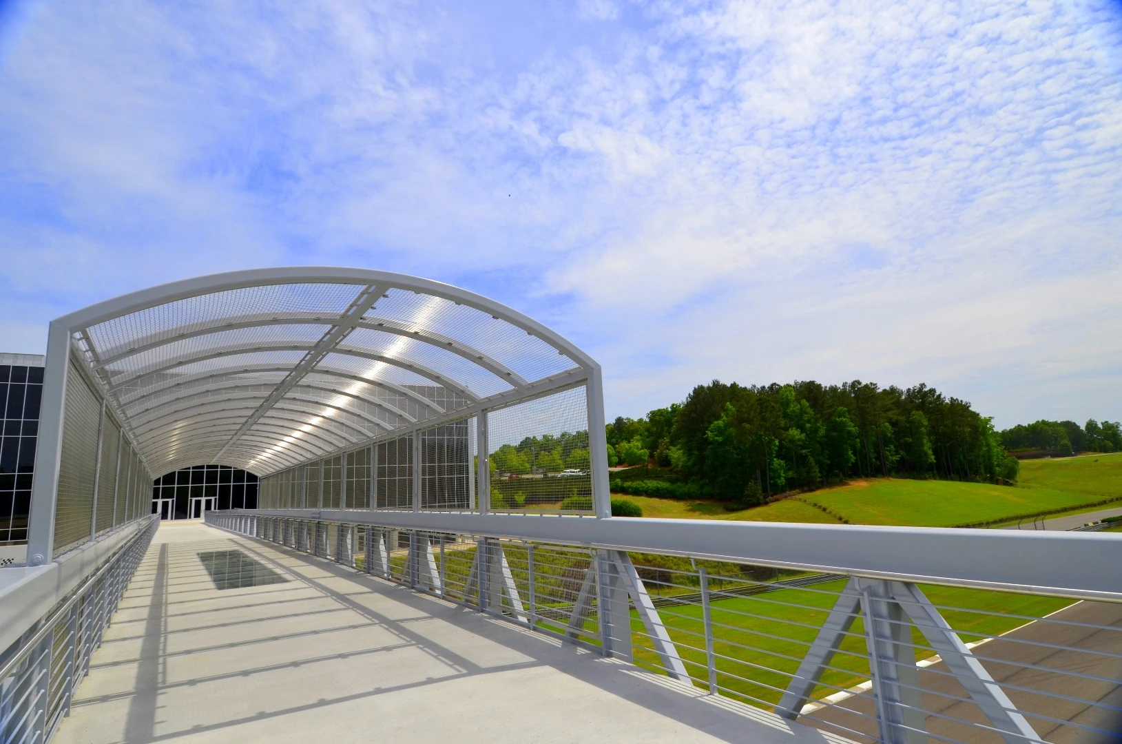 This bridge is the newest addition to the complex and features a glass bottom over the track