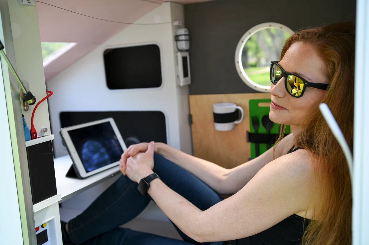 The table panel sets up inside to become a laptop workstation, viewing platform or dining area