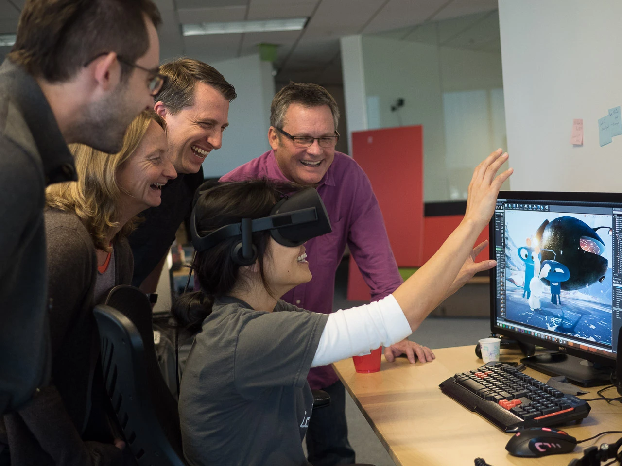Eric Darnell (in background), Maureen Fan (in VR headset), and the Baobab Studios team