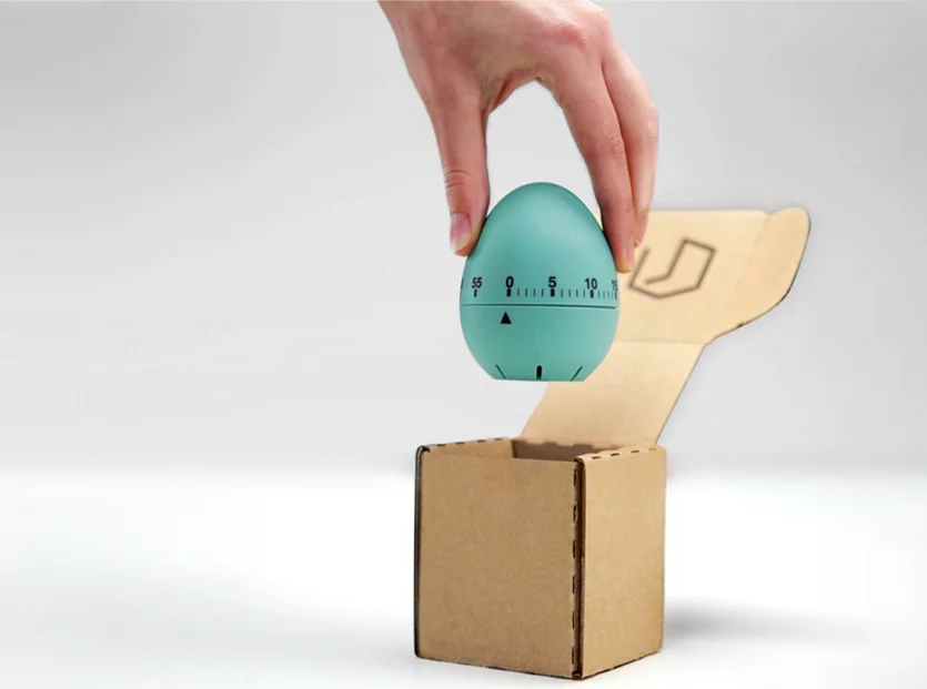 A kitchen timer and its custom Slimbox-made box