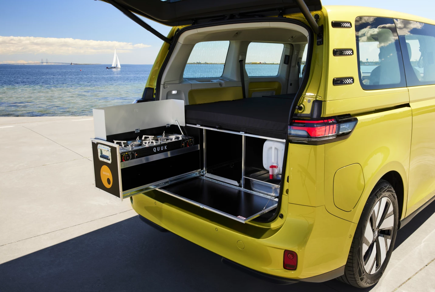 Drop the rear BusBox-4 panel out of the VW ID. Buzz tailgate and you get an outdoor kitchen with dual-burner stove, fresh water, sink and space for a fridge or cooler