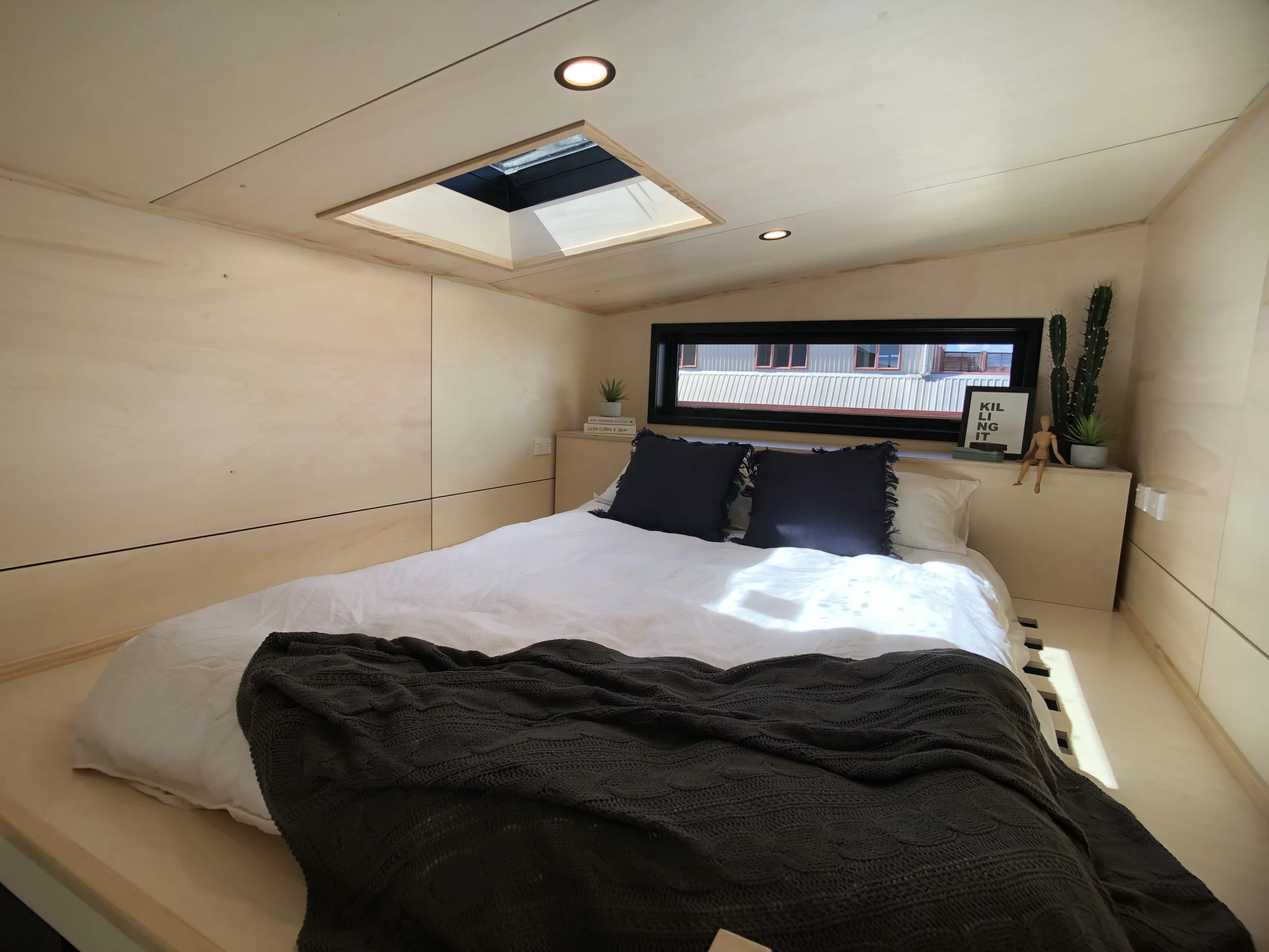 The Tiny Tāwharau's main bedroom is topped by a skylight