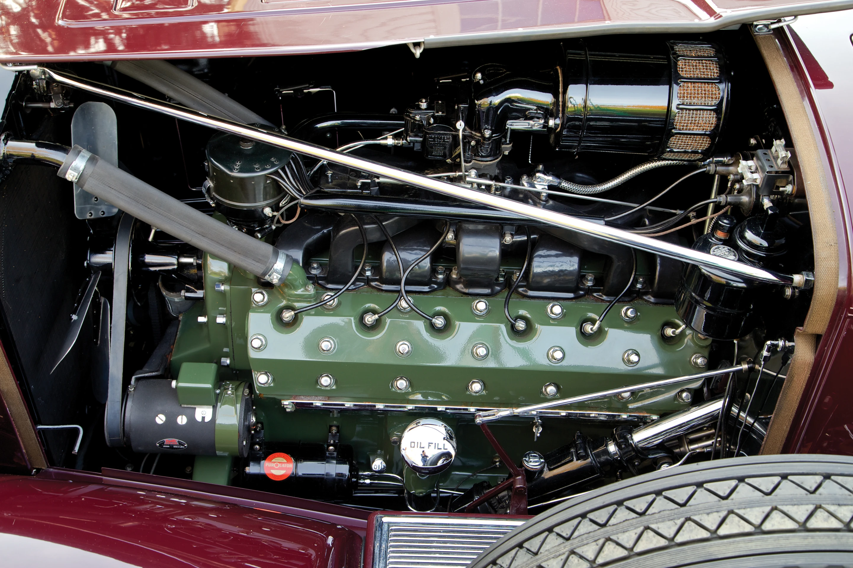 The 1932 Packard Twin Six Individual Custom Convertible Sedan runs on a 160 bhp, 445 cu. in. side-valve V-12 engine