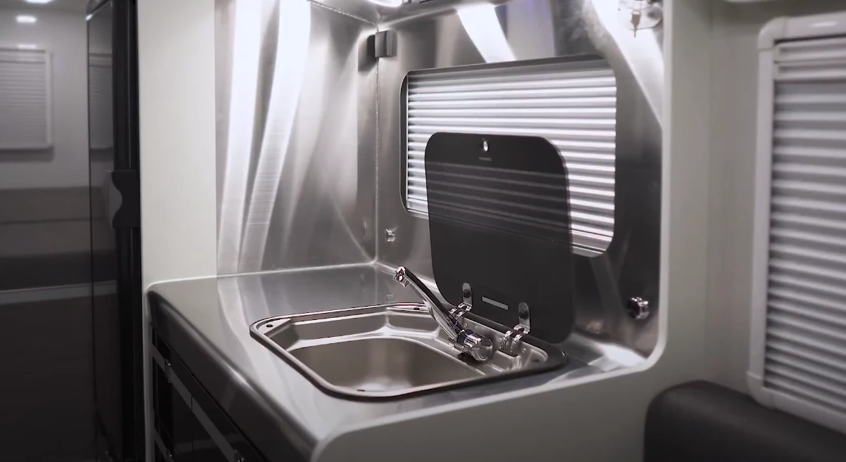 Somewhat different from what you'd find in an American or European RV, the Porest does away with the stove but packs a microwave and tall standalone fridge