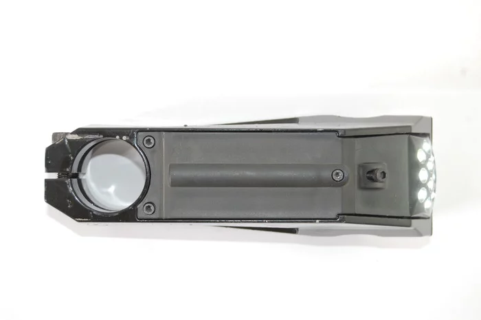 The battery compartment is accessed through an Allen bolt-secured hatch on the bottom of the stem