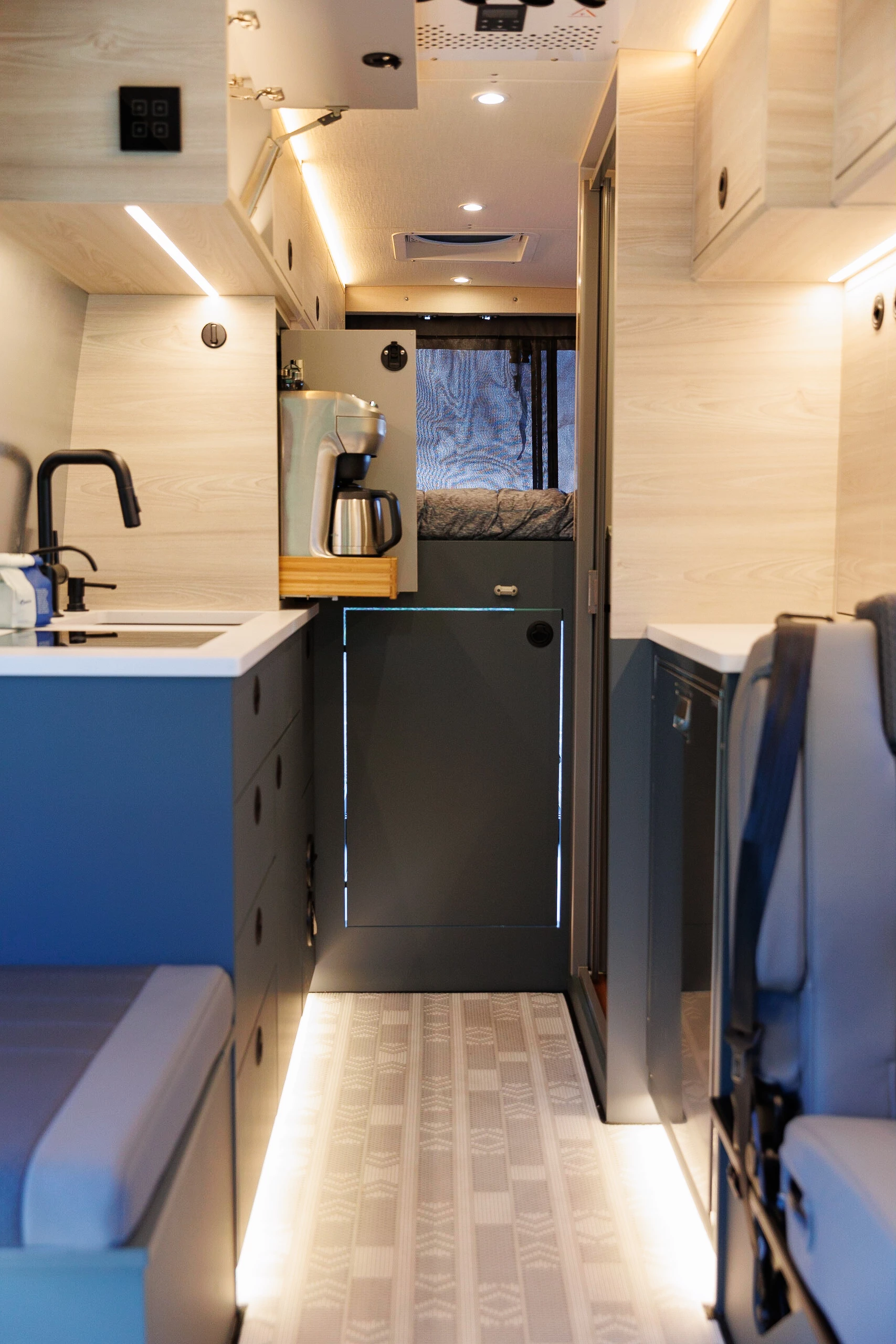 A look down to the garage access door and slide-out Breville coffeemaker