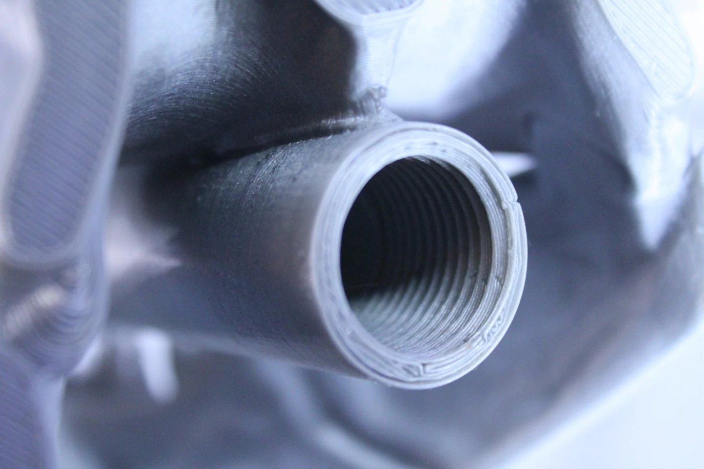 Even at middle quality, this shower head screwed on to a metal threaded pipe and didn't leak