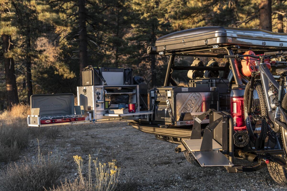 A trail kitchen unit mounted to a slide turns the sleeper Ranger into an overlanding camper