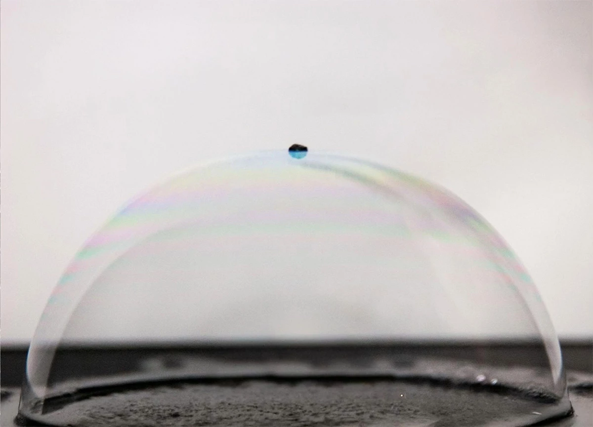 An ultralight carbon nanolattice consisting of 18.75 million lattice cells resting on a bubble