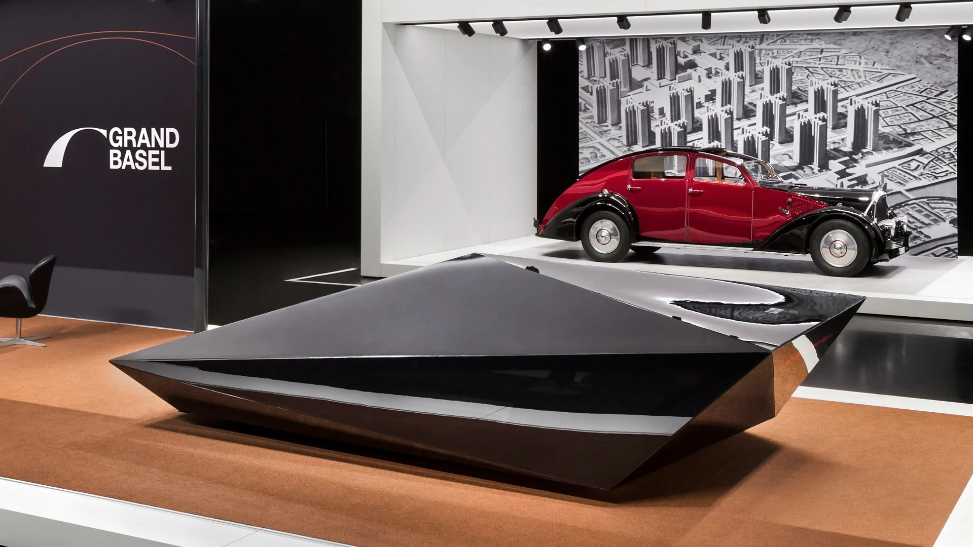 Designer Rem D. Koolhaas showed a new Lo Res car at the announcement of Grand Basel. The first Lo Res car was created by Koolhaas for his United Nude fashion brand, by abstracting the polygonal form of a Lamborghini Countach into a minimalist wedge shape.