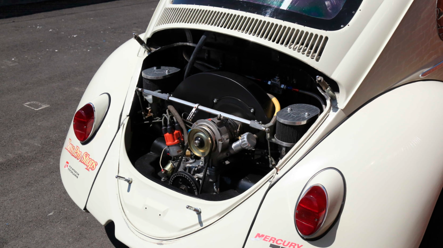 This Herbie was one of three built to outrageous performance specifications with a 2300cc engine breathing through two 48mm Weber carburetors )see the massive air filters visible in each side of the engine bay) and driving through a four-speed racing transmission. Each of the three NASCAR Herbies cost about $75,000 to build, with $20,000 of that spent on the drivetrain, which accounts for why, during testing at Irwindale Speedway and California Speedway, this car was timed at 138 mph ( 222 km/h)