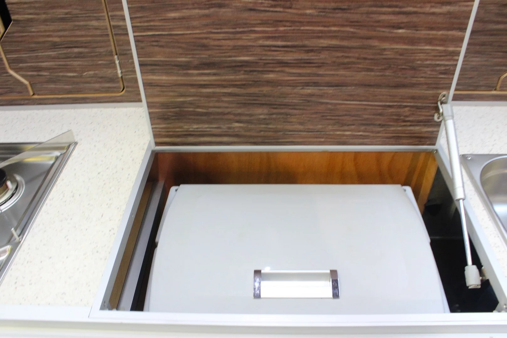 Refrigerator stored neatly below the Lifestyle X-Line's counter