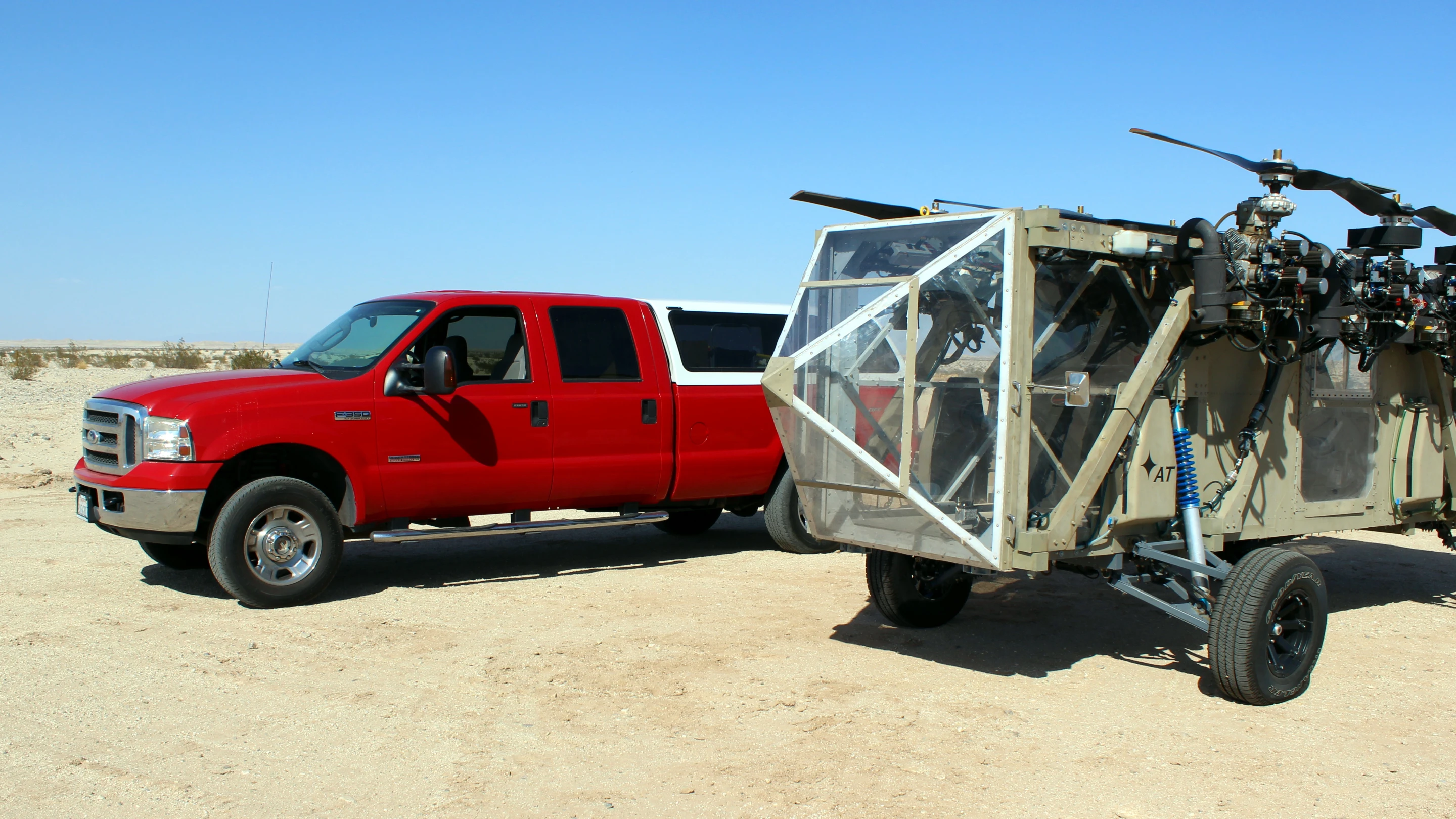 The Black Knight Transformer is larger than a Ford F350 crew cab truck, shown for scale – the engines are stowed against the side of the vehicle in driving configuration