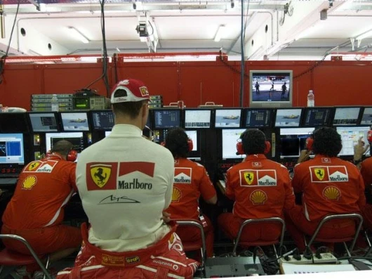 Michael Schumacher now has a challenge worthy of a champion. Here he watches the early qualifying on Sunday morning prior to going out to snaffle another front row start